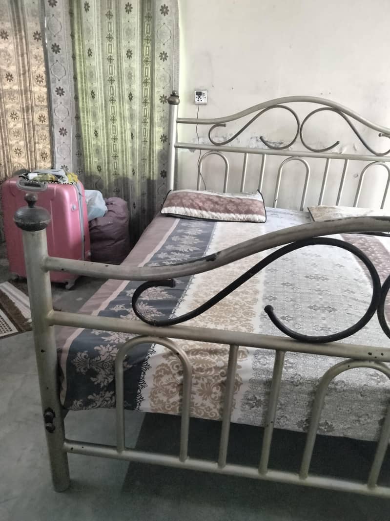used solid iron King size bed 1