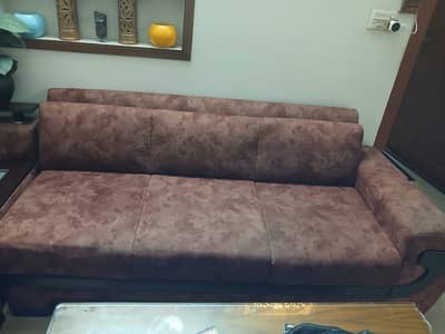 L shaped sofa with center table