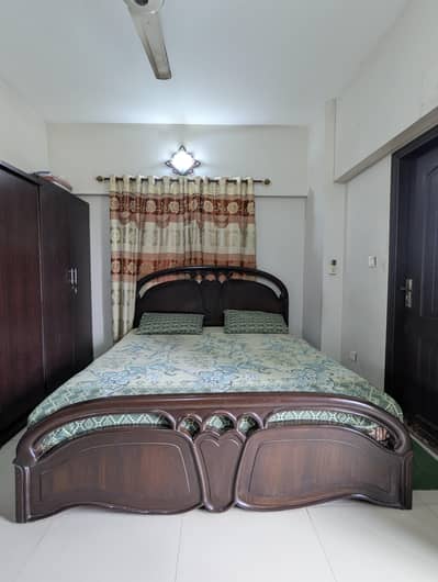 king size bed with dressing table and cupboard