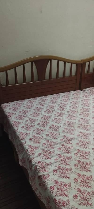 single beds with side table and mattresses