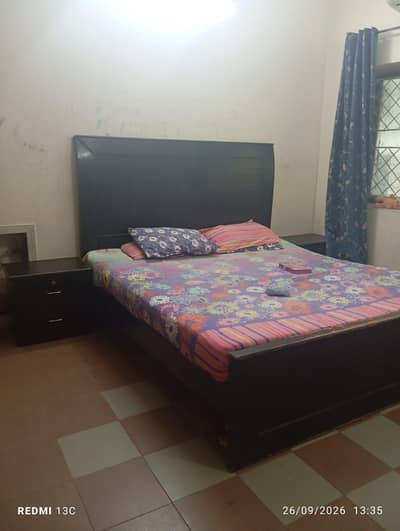 Double bed with side tables and dressing table