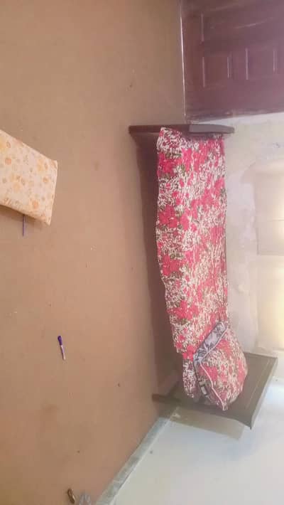 a single wooden bed