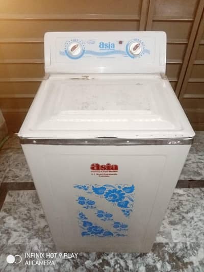 Asia washing machine. . . steel body. . . large size