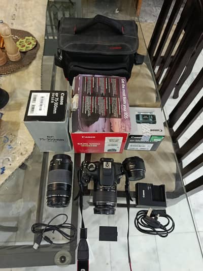 DSDSLR Canon 1200D along with extra lenses and accessories