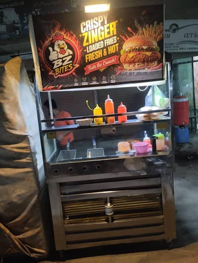 Running Fast food cart zinger and fries counter
