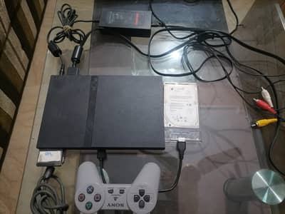 PlayStation 2 with Accessories and Games