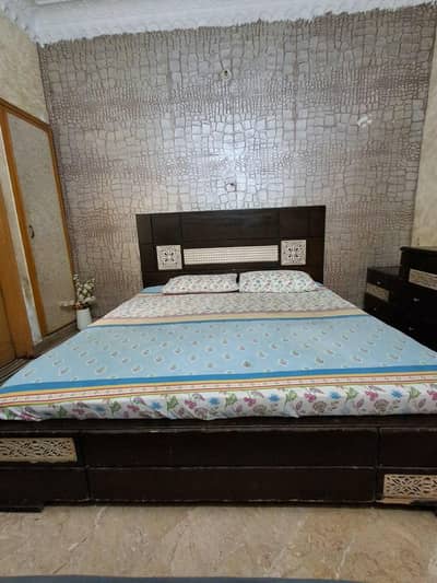 Bed with two side table one dresser