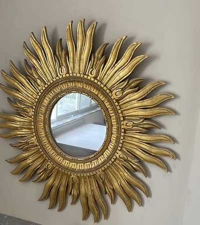 Beautiful gold sun shaped mirror