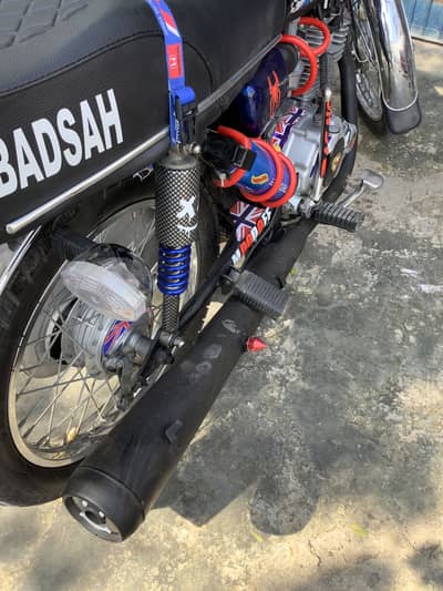 Honda 125 2014 model ha  peshawer number ma ha 120000 demand ha