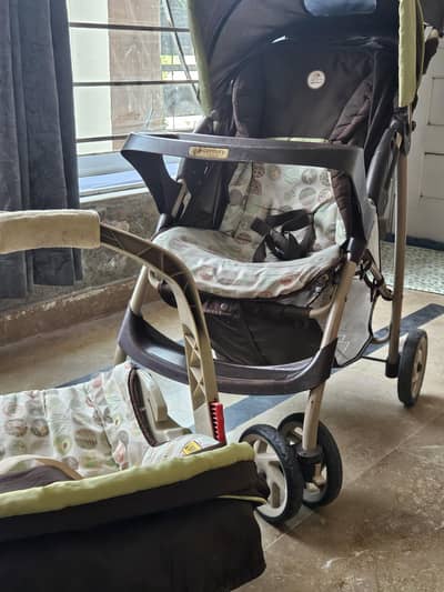 Graco baby stroller (pram) with car seat (crib) and portable cot.
