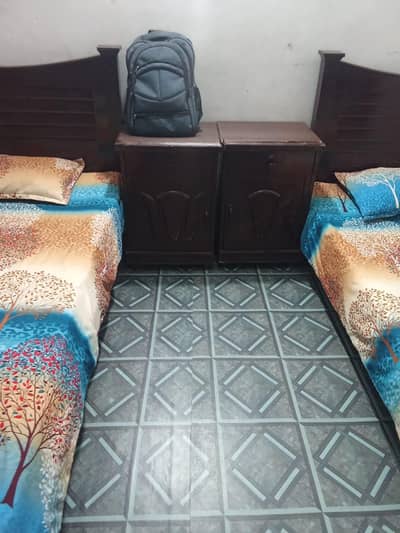 2 Single beds along with 2 sude tables and a single mattress