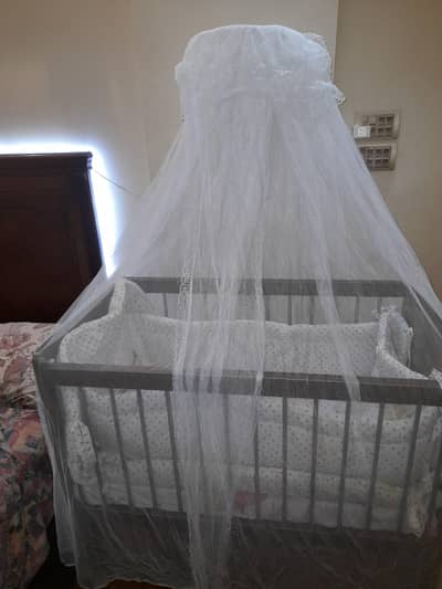 wooden baby cot with mattress and mosquito net