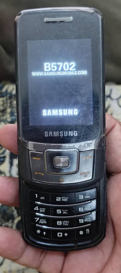 Samsung 5702 Slide keypad Mobile phone old is gold Pta Aprove