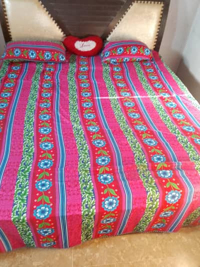 wooden bed with mattress