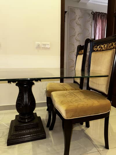 Dinning table with chairs.