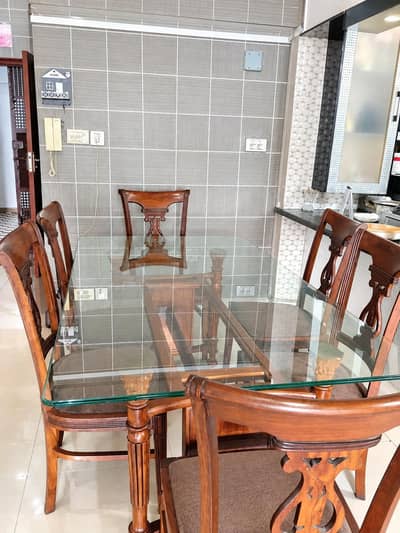 Wooden dining table with chairs
