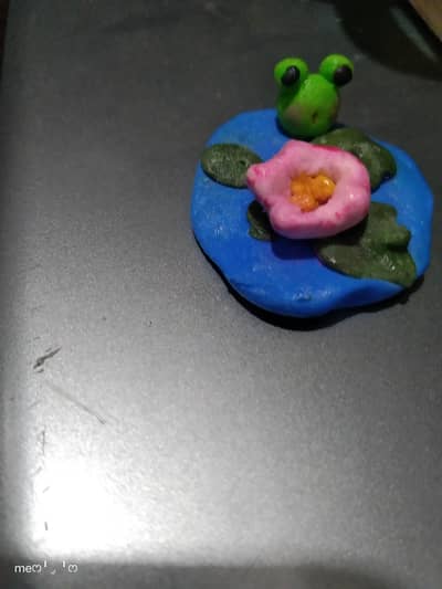 frog.   and. lotus. flower. miniature.   very small