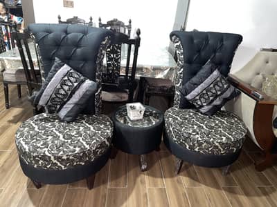 Two sofa chairs with coffee table