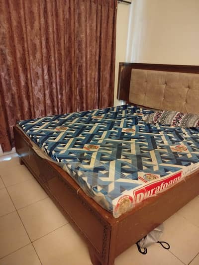 Wooden double bed for sale