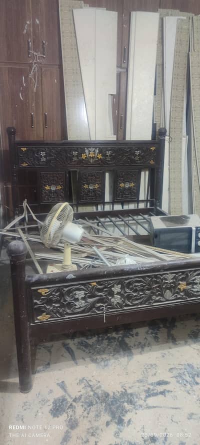 Double iron bed for sale.