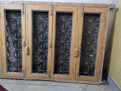 Woden window with iron grill new condition