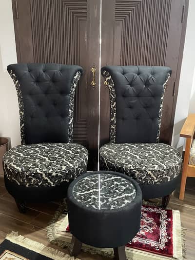 Two sofa chairs with coffee table