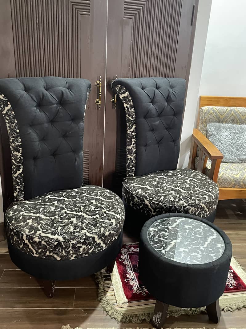 A pair of black high-back tufted accent/Sofa chairs with table 1