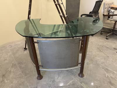 Premium quality glass-top office table available for sale.