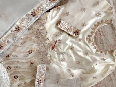 white maxi with tites medium size dull golden and silver touch