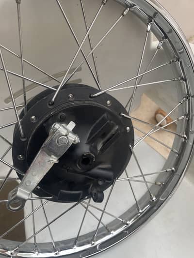 125 front wheel brandnew with complete