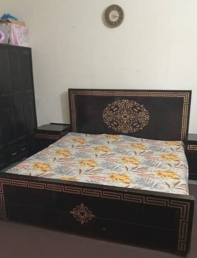 Double King size Bed along with 2 side tables.