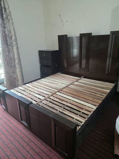 wooden solid bed with mirror and side tables