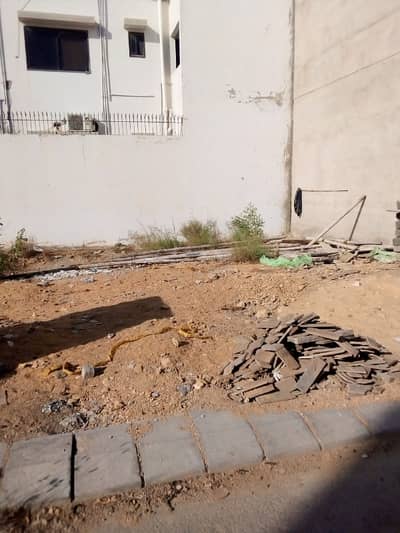 100 Sq. Yards Plot DHA Phase 7 Extension, Karachi Prime Location Near Fatima Masjid Ideal For Investment Or Future Construction.