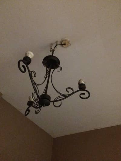 metal lamp with retro fancy candle bulb