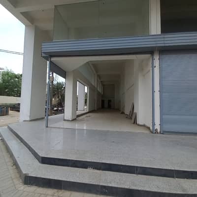 FOR RENT: PRIME MAIN-ROAD GROUND SHOWROOM WITH BASEMENT CLIFTON BLOCK 9, KARACHI