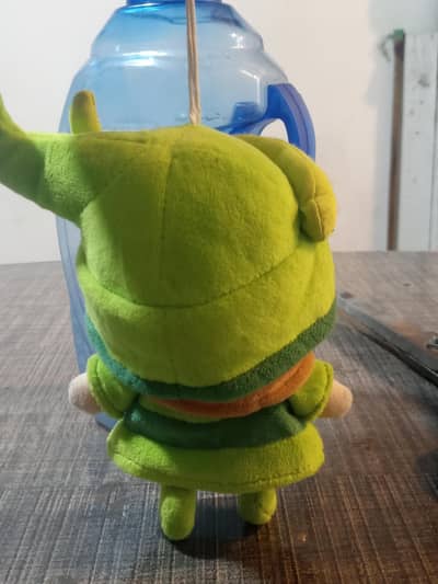 Small green hanging doll toy imported