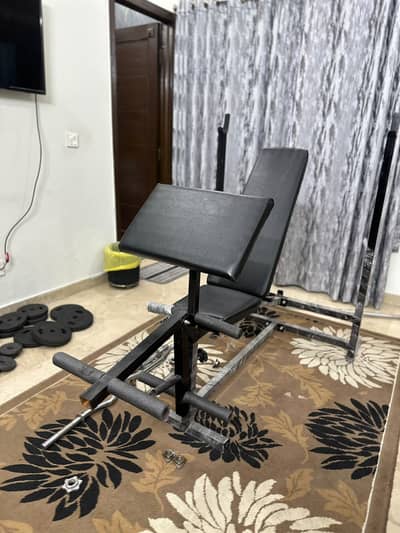 Home Gym Equipment: Adjustable bench, bars, weights.