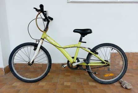 B'Twin children's bicycle with 20-inch wheels.