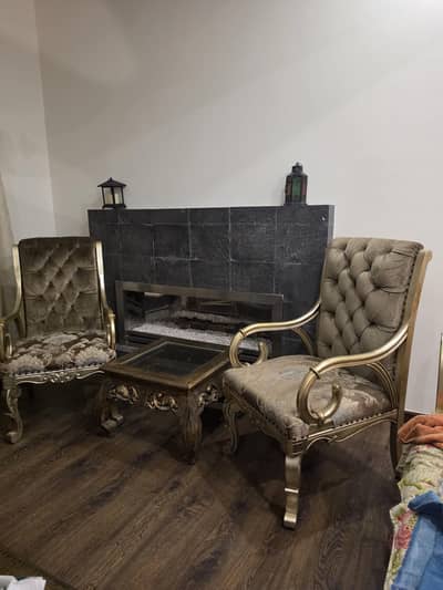 2 chairs and 1 center table.
