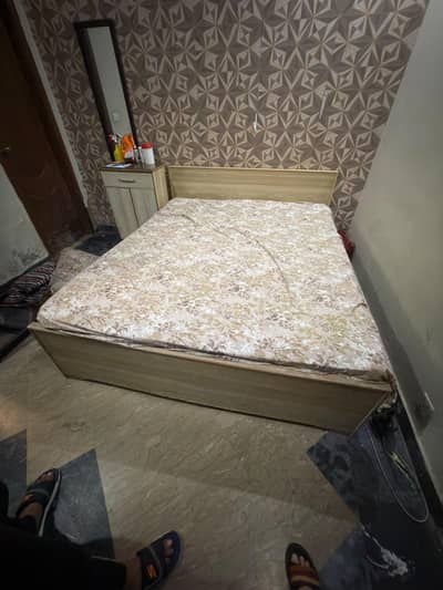 Queen size bed with spring mattress in used condition