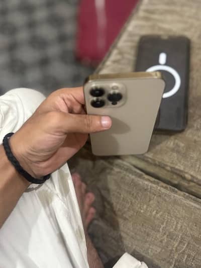 I phone 13 pro max pta approved water pack 10/10 condition Goldern clr