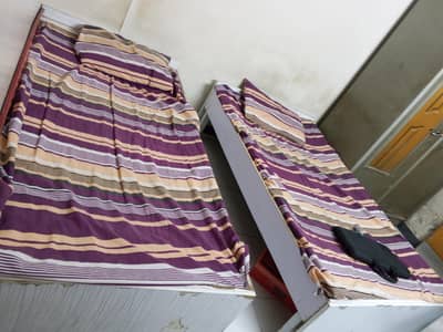used pair of single bed