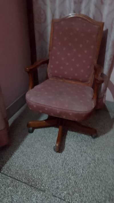 Upholstered wooden office chair with casters