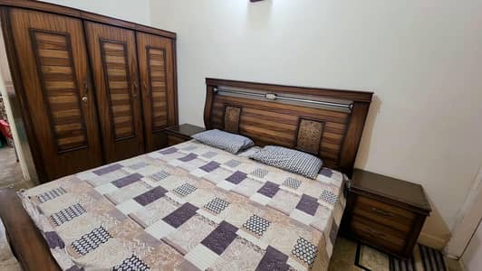 Bed with side tables, cupboard,iron table with spring mattress