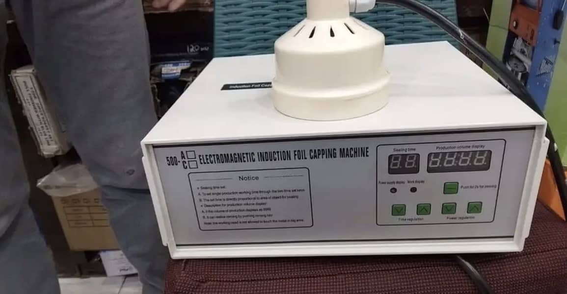 Electromagnetic induction foil capping machine 2