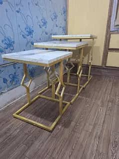 set of 3 cofee table and a center table