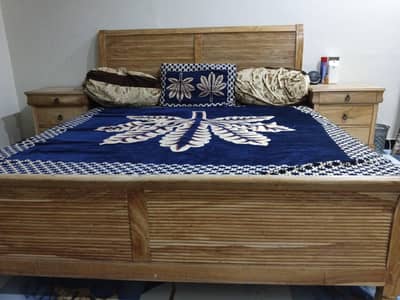 king size bed with side tables and mattress