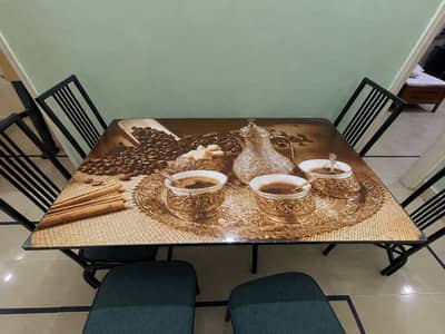 Table Features • Glass top featuring a warm-toned coffee and tea graph