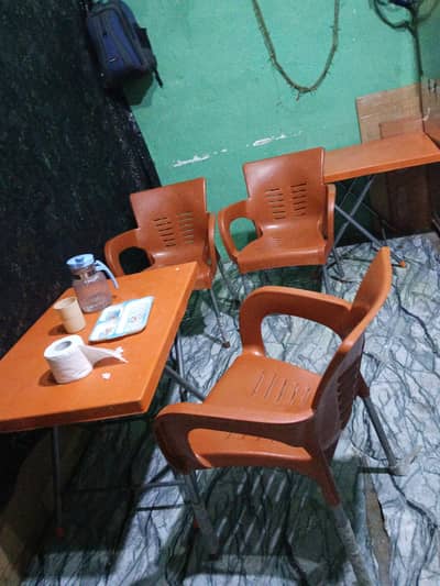 1 shawarma. counter. 1  smosa counter . 1 mini fridge. 2 tables . 6 chairs.