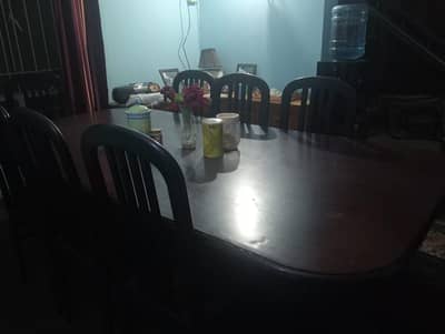 Dining table with 8 chairs(used) negotiable